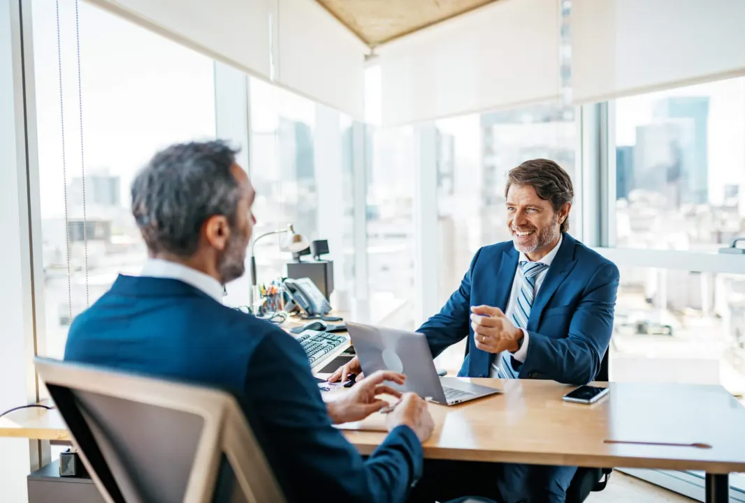 A candidate taking part in an in-person interview with an AscendRev team member.
