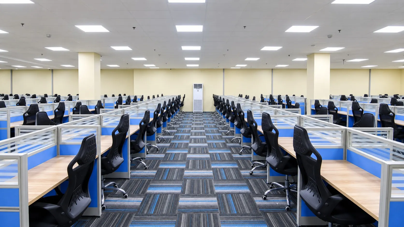 Rows of workstations and cubicles on an operations floor.